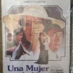 UNA MUJER EN LA VENTANA